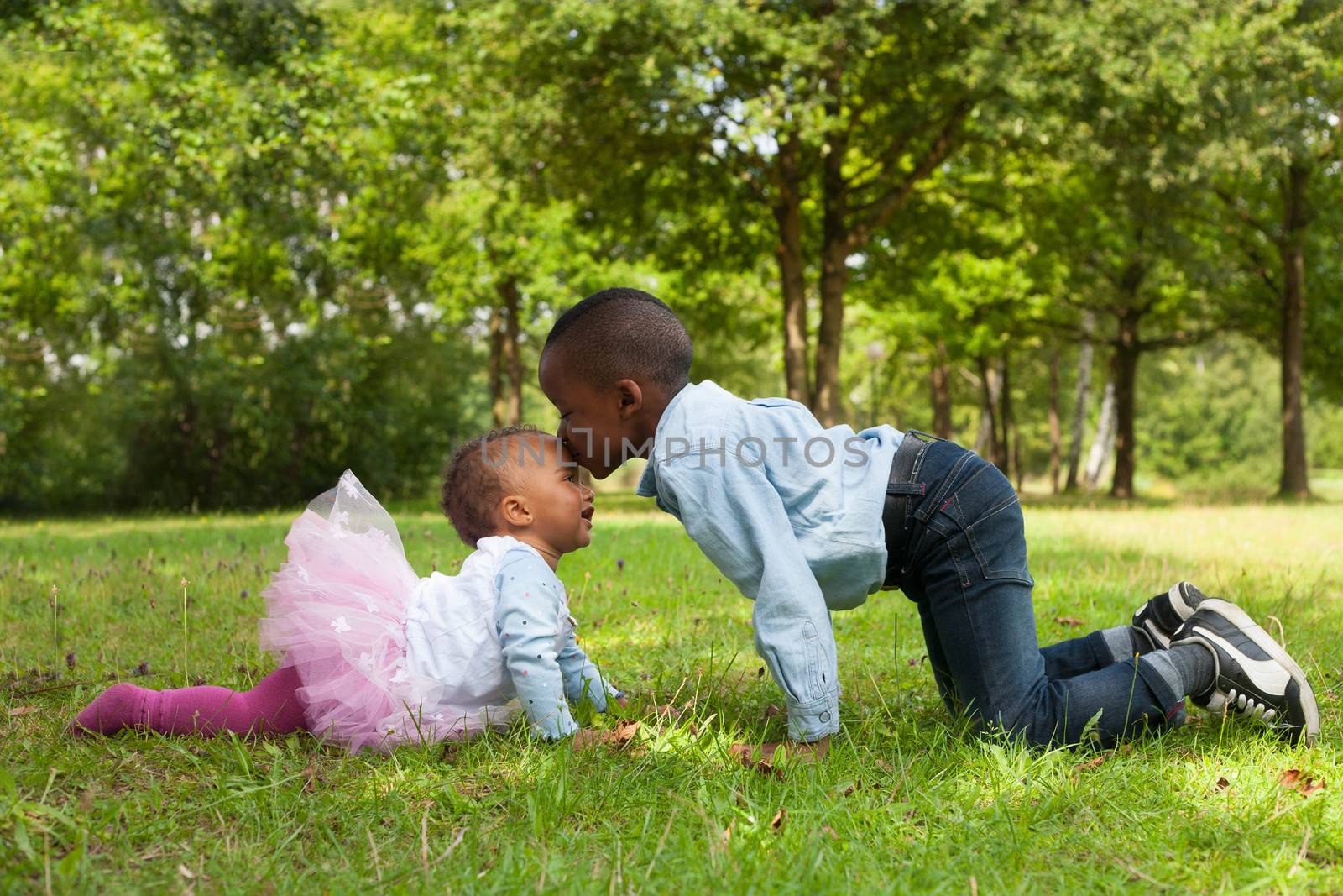 Happy little children are having a nice day in the park