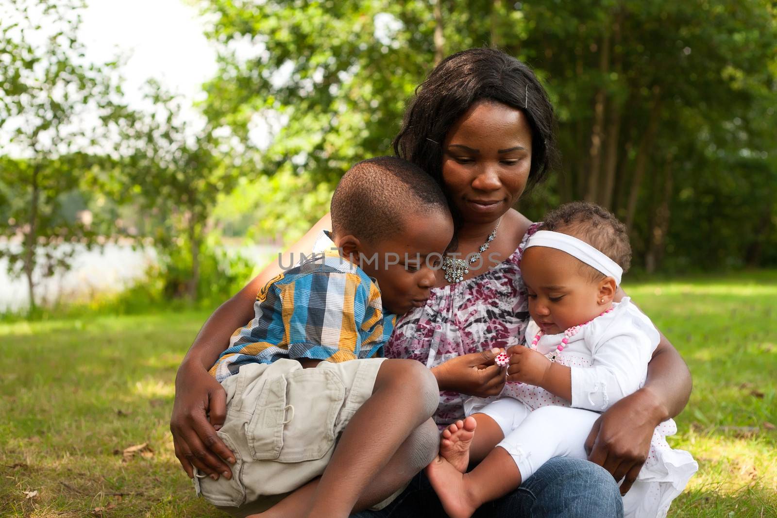 Happy mixed family is having a nice day in the park