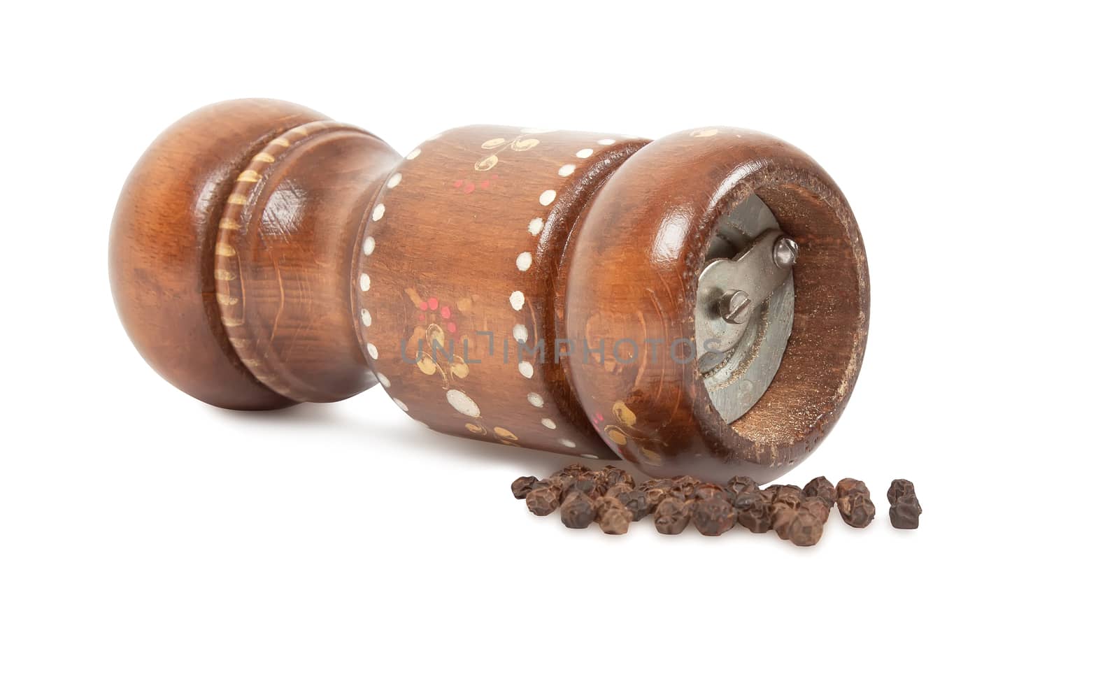 wooden peppermill and peppercorn isolated on white background