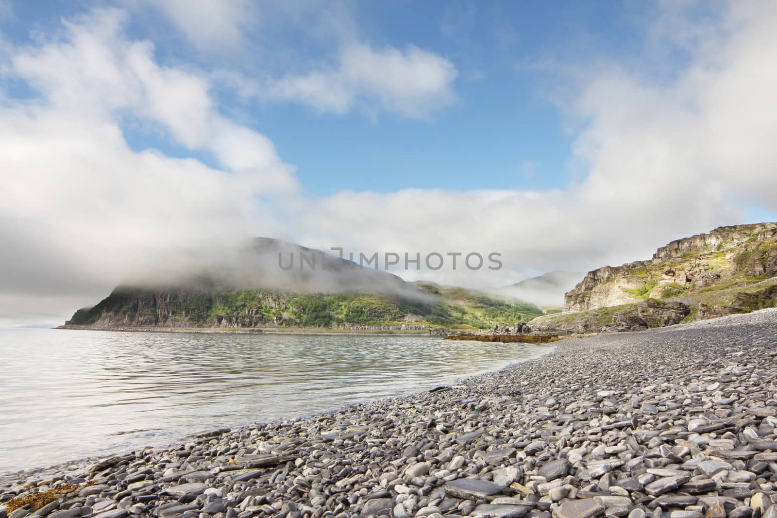 Norwegian fjord and mountains in cloudy weather