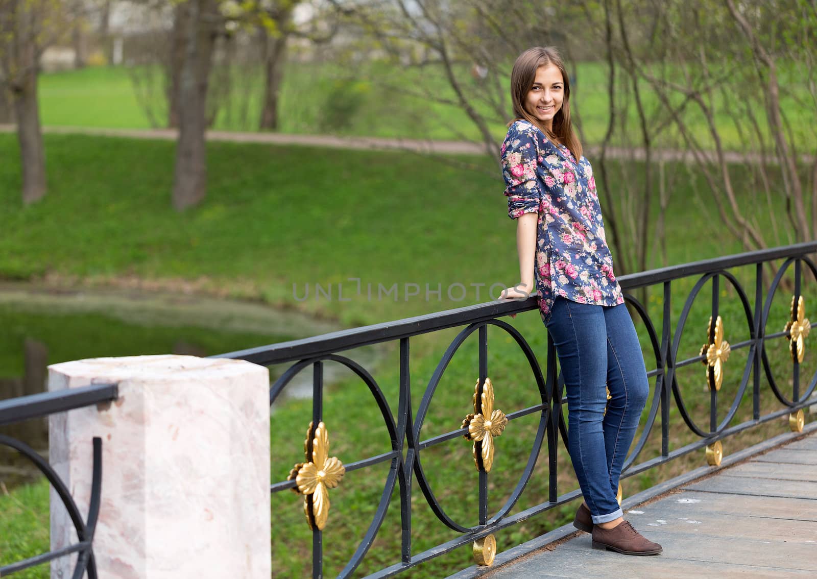 portrait of a beautiful full-length girl in the park