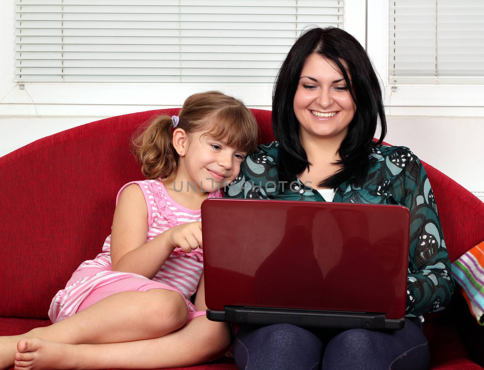 little girl and woman with laptop by goce