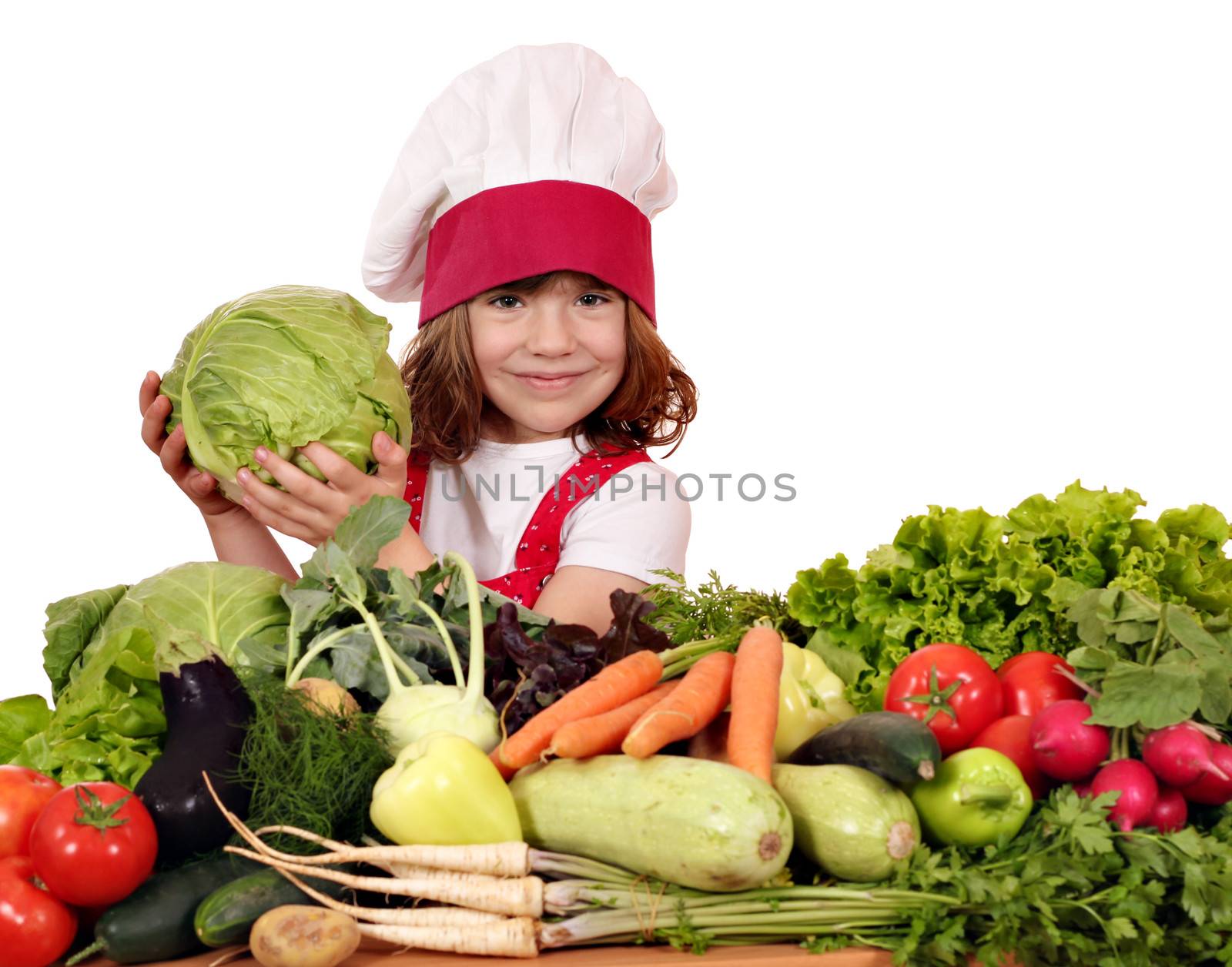 little girl cook with cabbage and vegetables by goce
