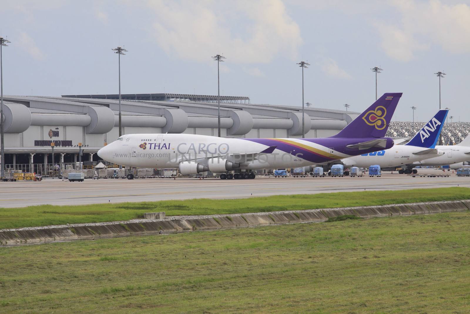 Bangkok-JULY25:thaiairway cargo plane parking at Suvarnabhumi airport  for loading goods material on July25,2013,Suvarnabhumi airport have carried 1,245,441 tons of cargo material last years (2012)