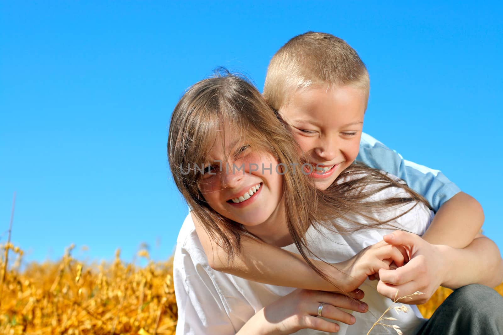 brother and sister in the summer field