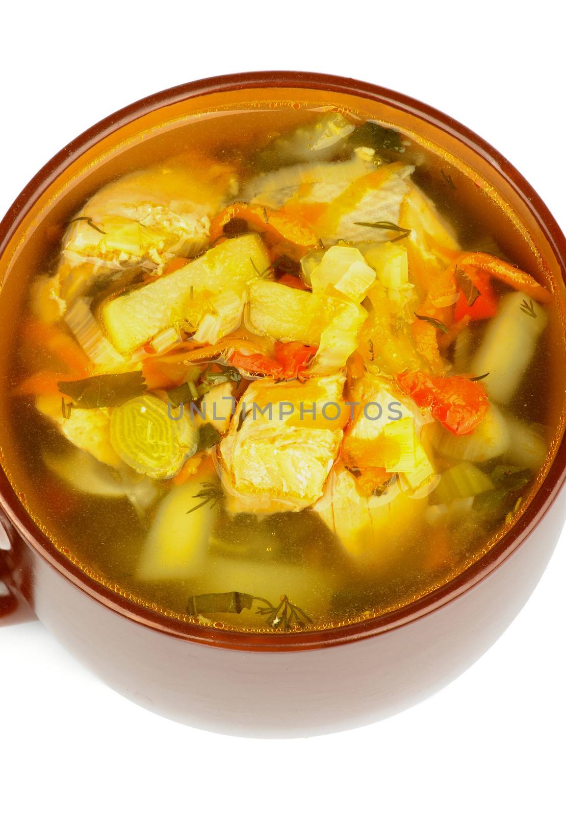 Delicious Fish Soup with Salmon, Potato, Leek, Carrot and Greens in Brown Soup Cup closeup on white background