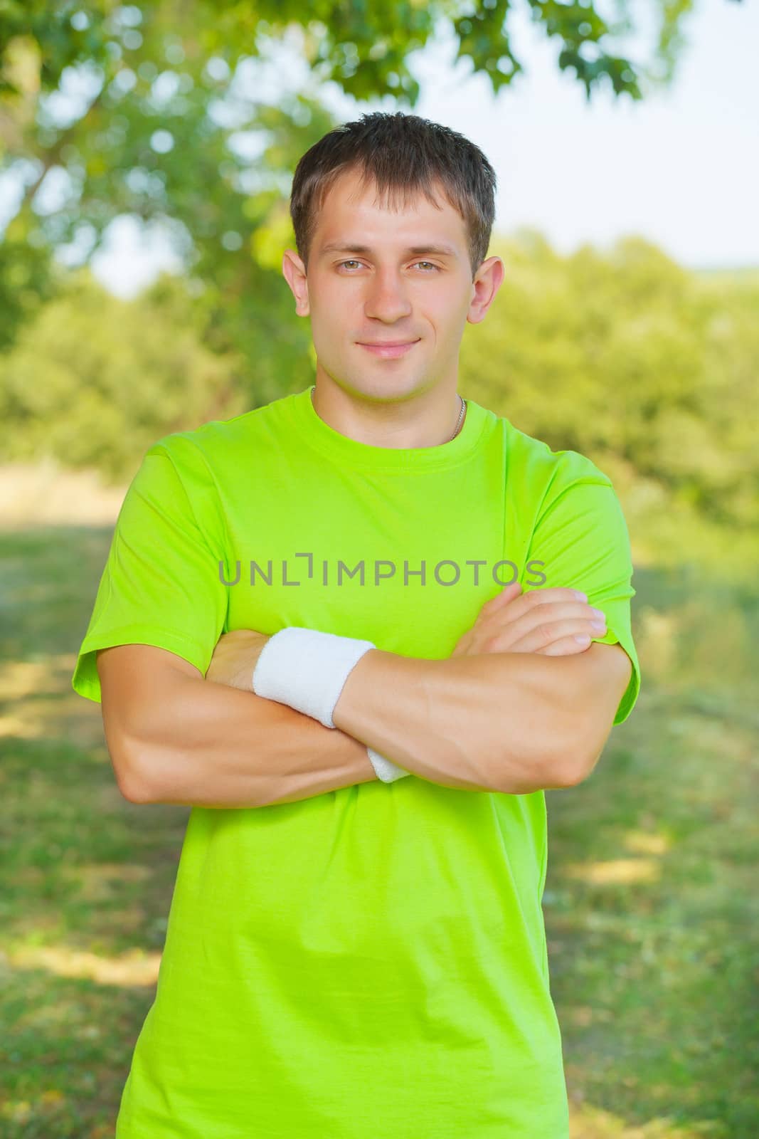 a men wearing in green t-shirt by mihalec