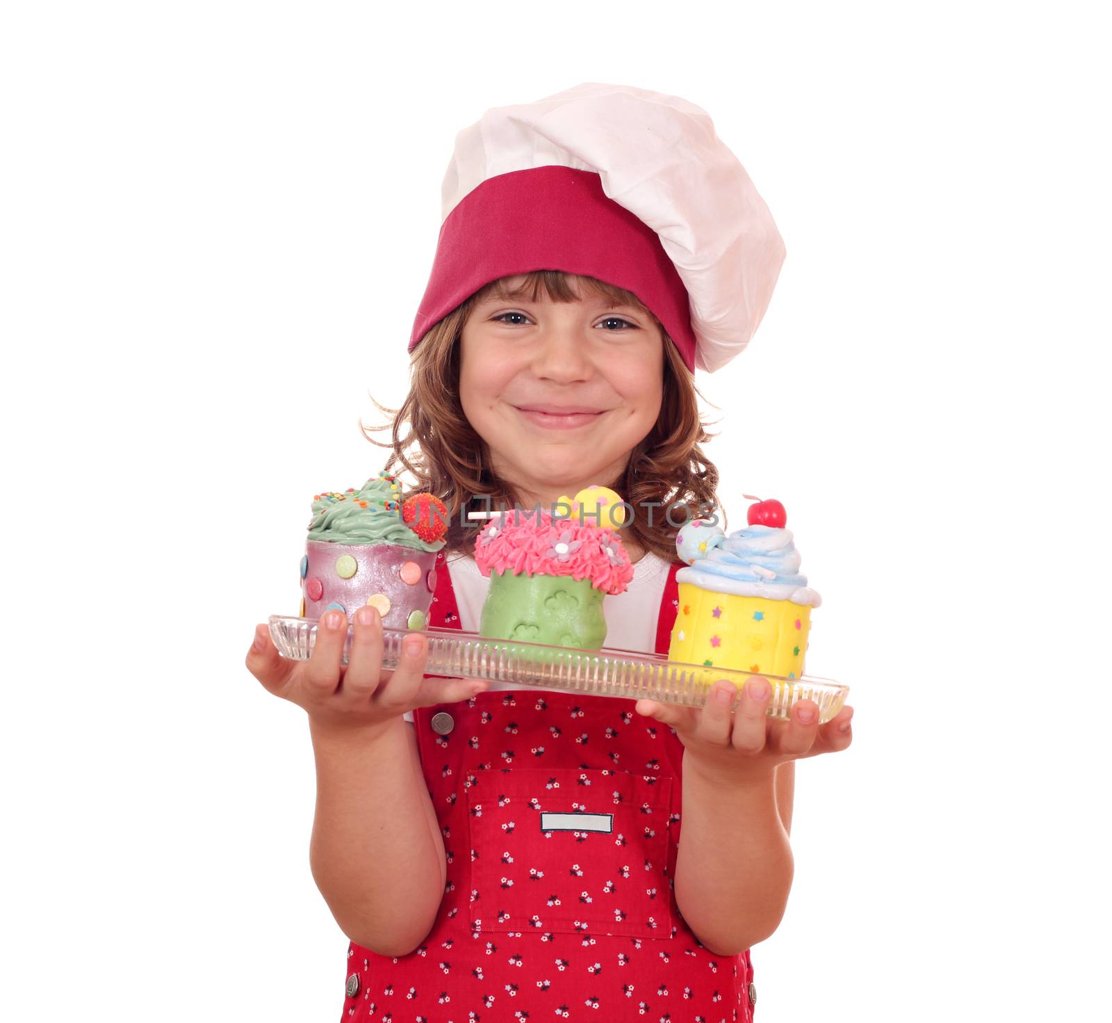 happy little girl cook with colorful sweet cupcakes
