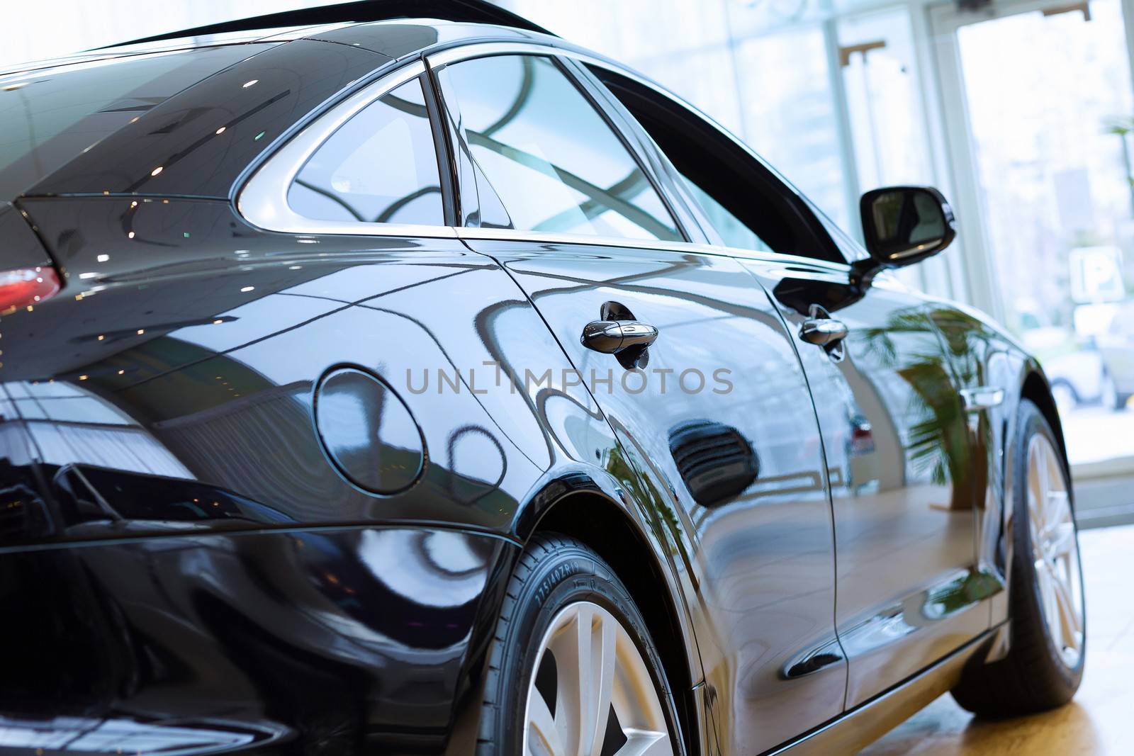 Back view of automobile in sales salon