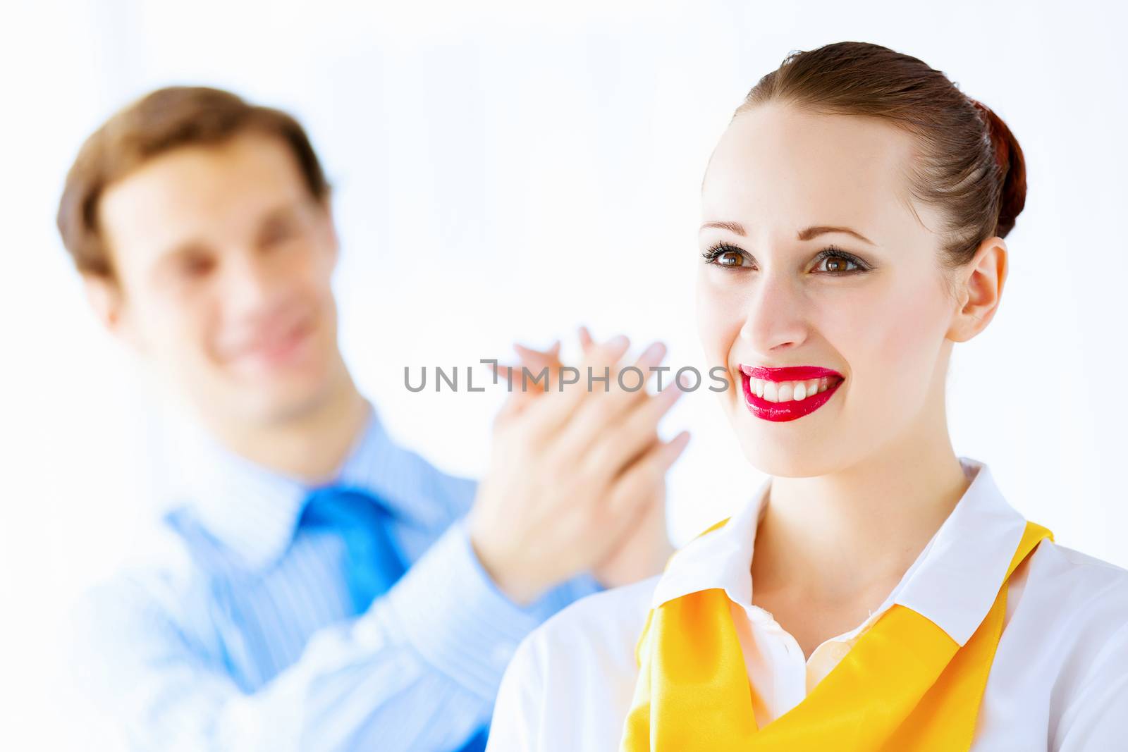 Image of businessman and businesswoman smiling joyfully