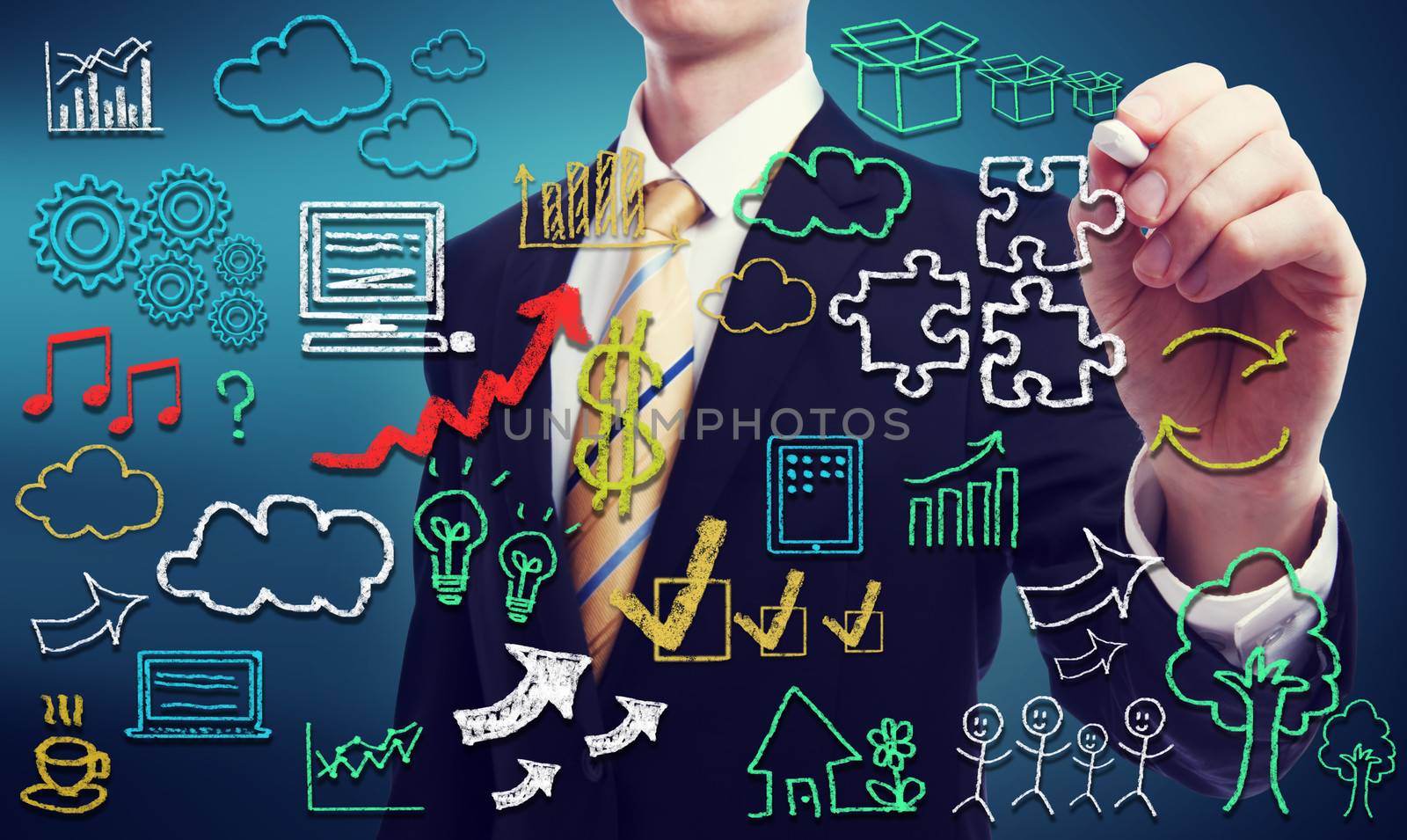 Businessman with hand written cloud computing themed texts and pictures 