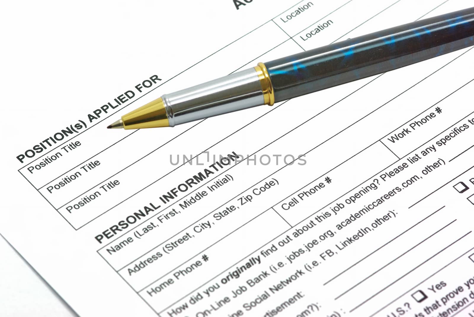 Application form with a pen on it