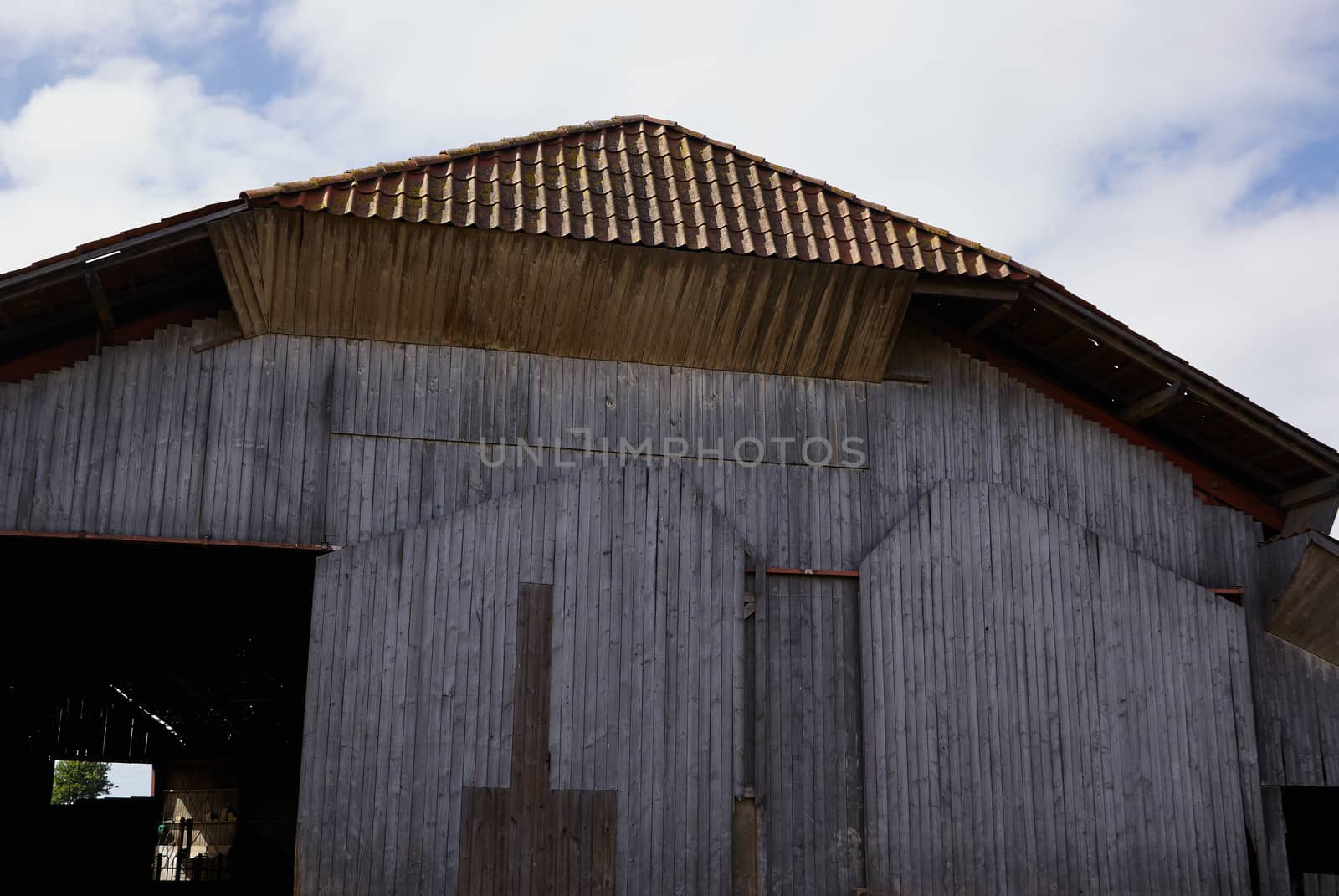  Old vintage barn in a farm agriculture background image             