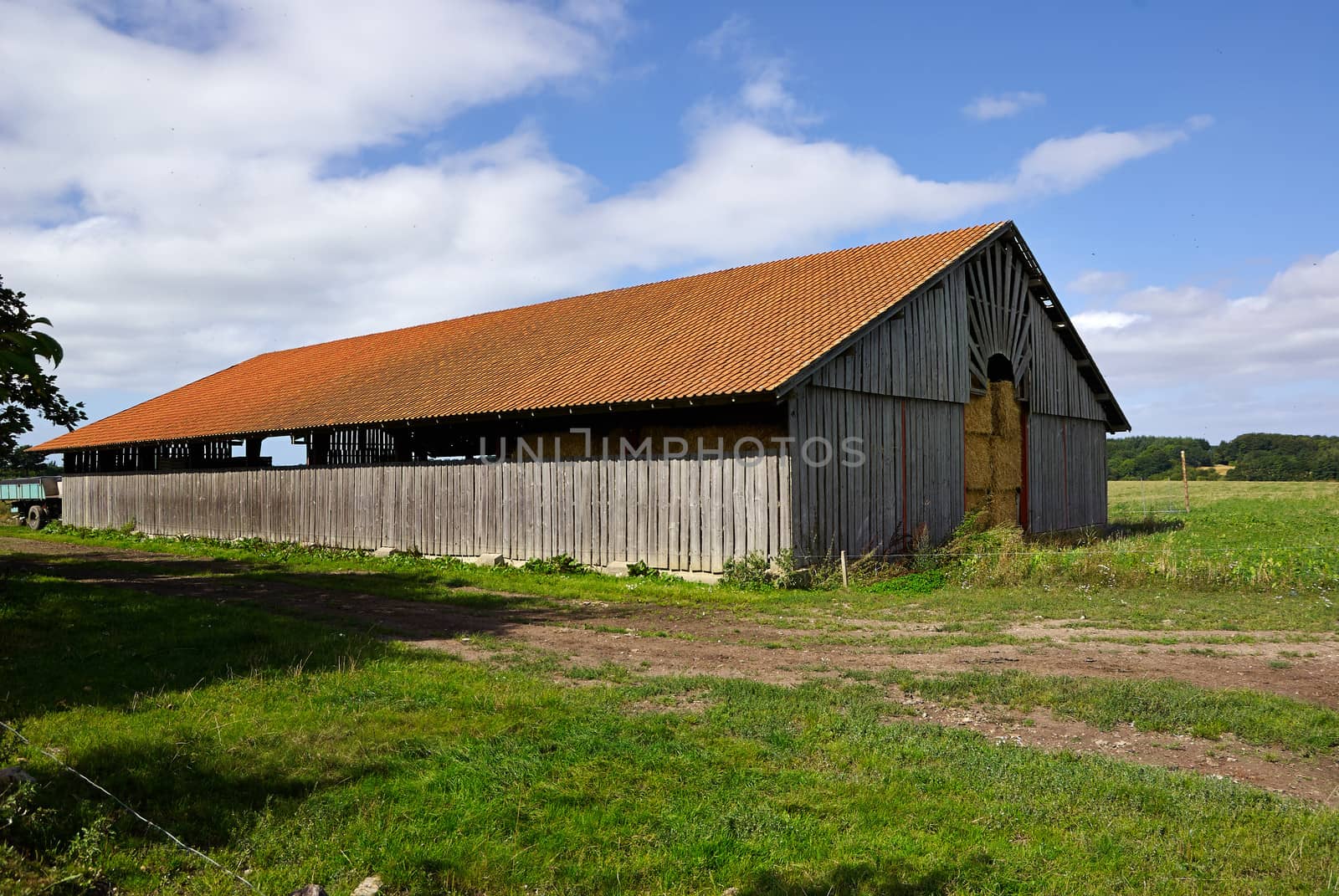 Old vintage barn in a farm agriculture background image