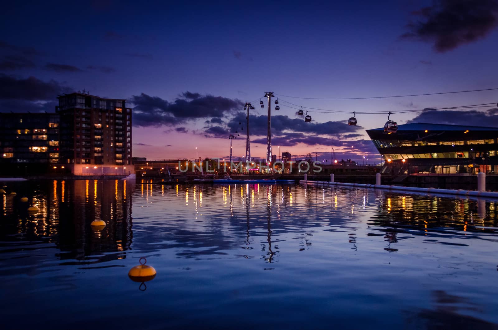 Cable cars in the sunset at Royal Victoria docks, London