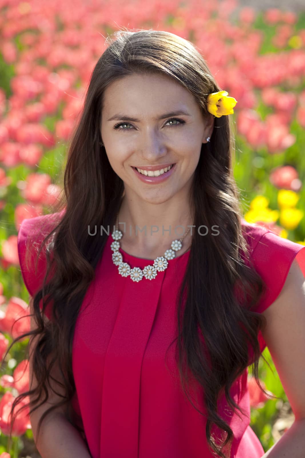 Beautiful young woman with tulips