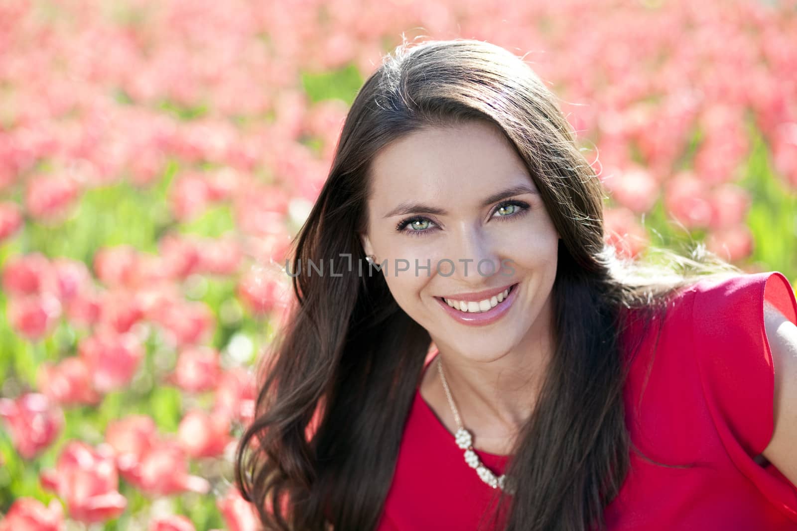 Beautiful young woman with tulips