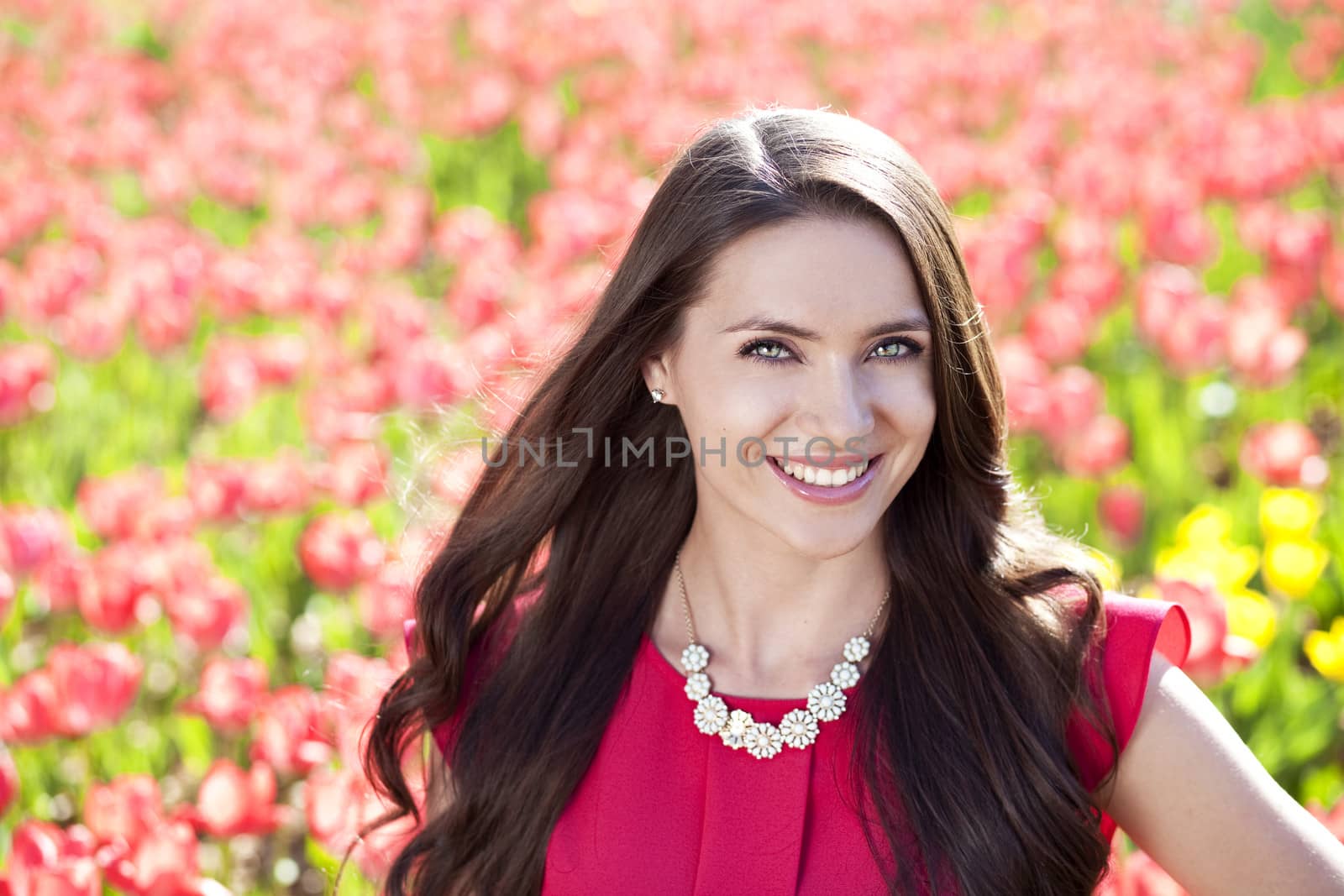 Beautiful young woman with tulips