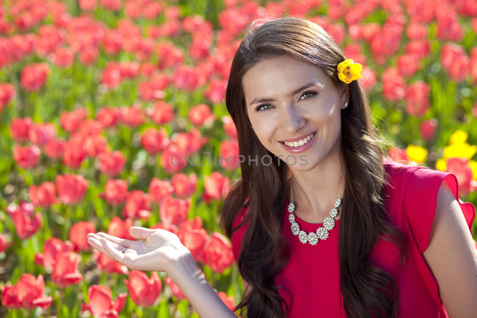 Beautiful young woman with tulips