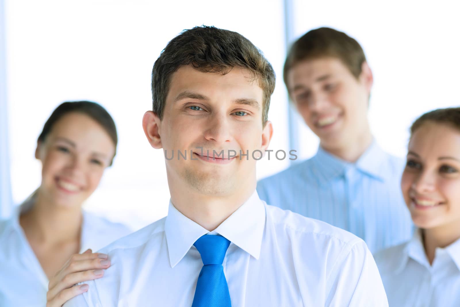 businessman receiving congratulations from his colleagues, business achievements