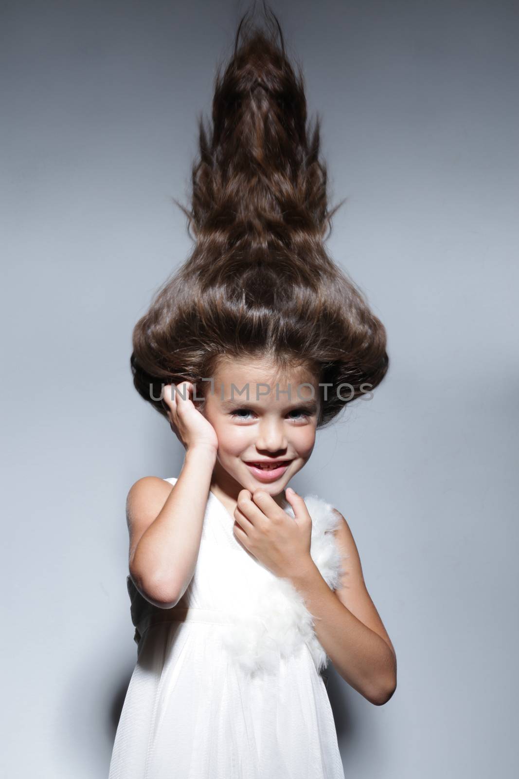 close up portrait of young beautiful little girl with dark hair