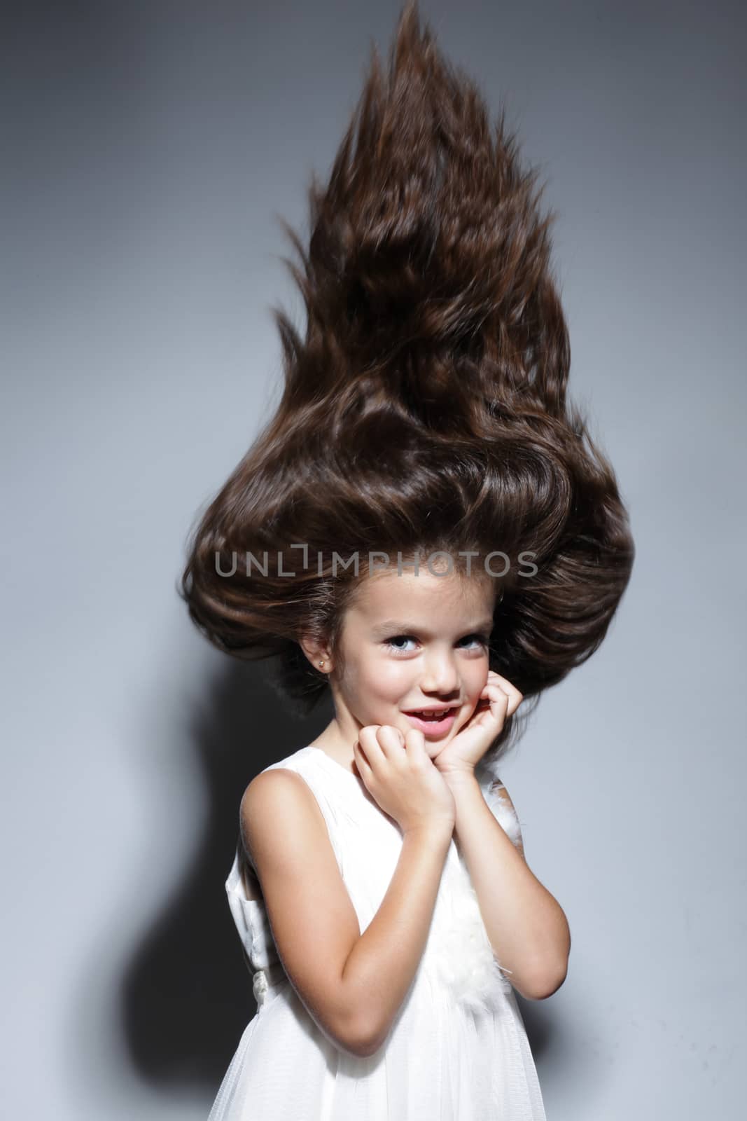 close up portrait of young beautiful little girl with dark hair