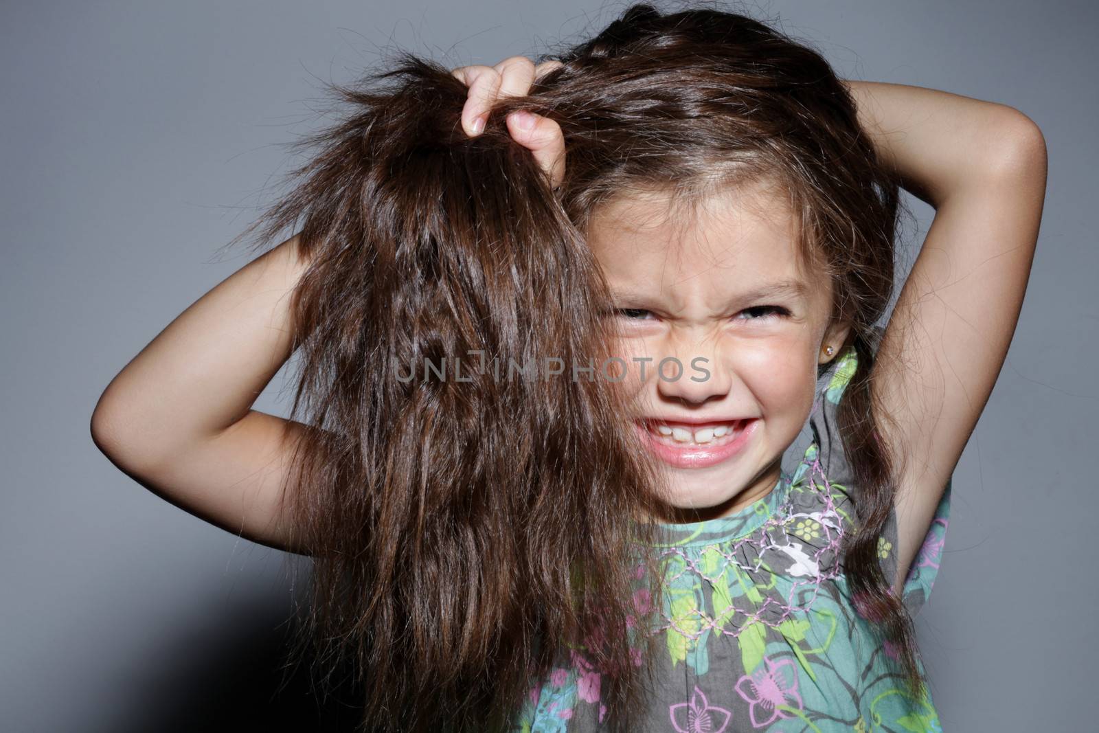 close up portrait of young beautiful little girl with dark hair