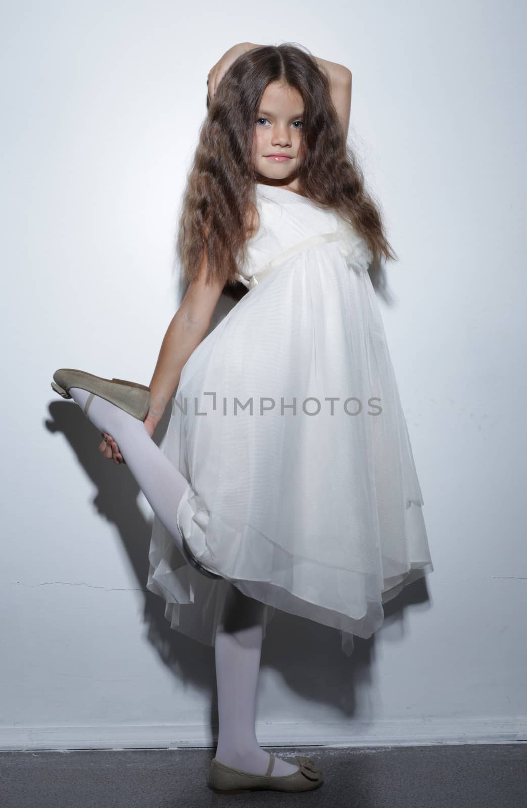 full-length portrait of a little girl in the studio