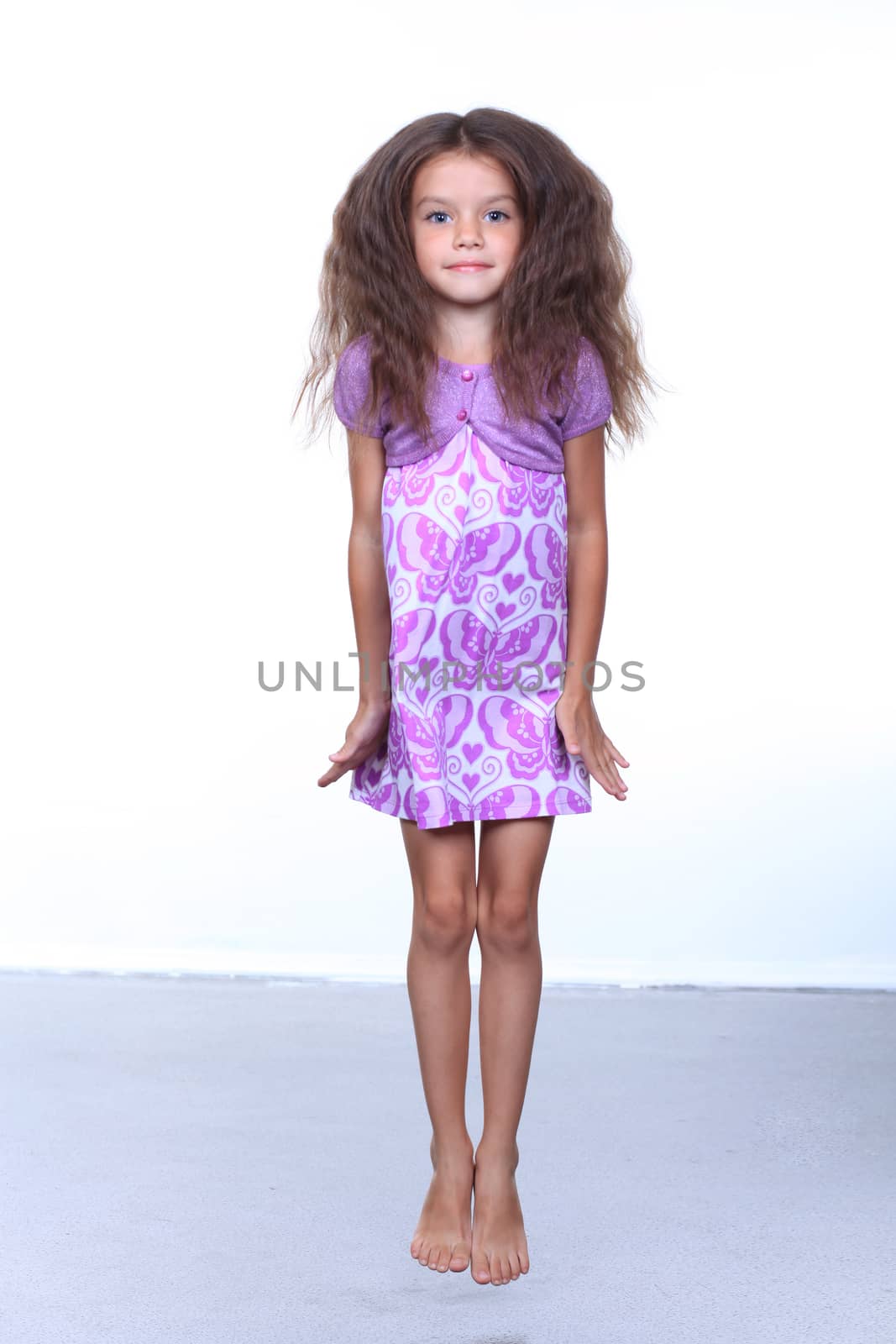 full-length portrait of a little girl in the studio