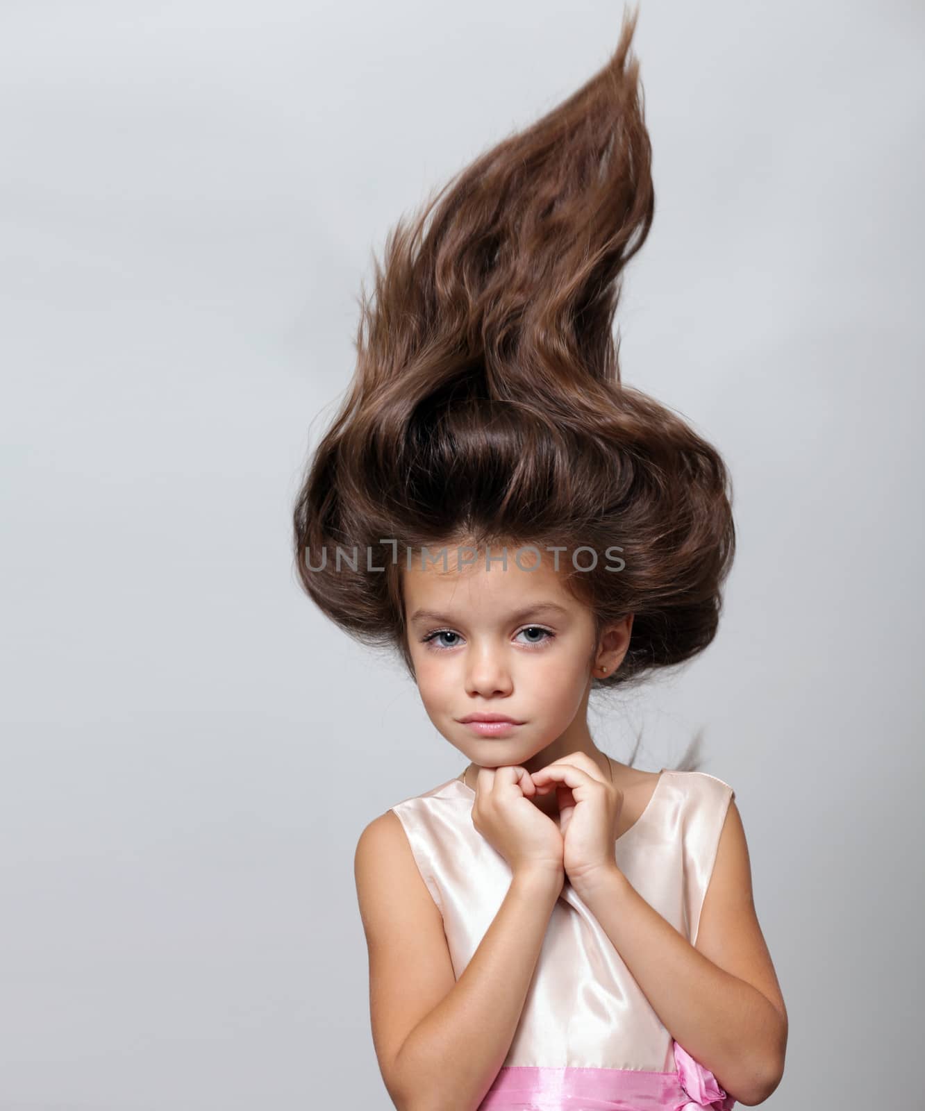 close up portrait of young beautiful little girl with dark hair