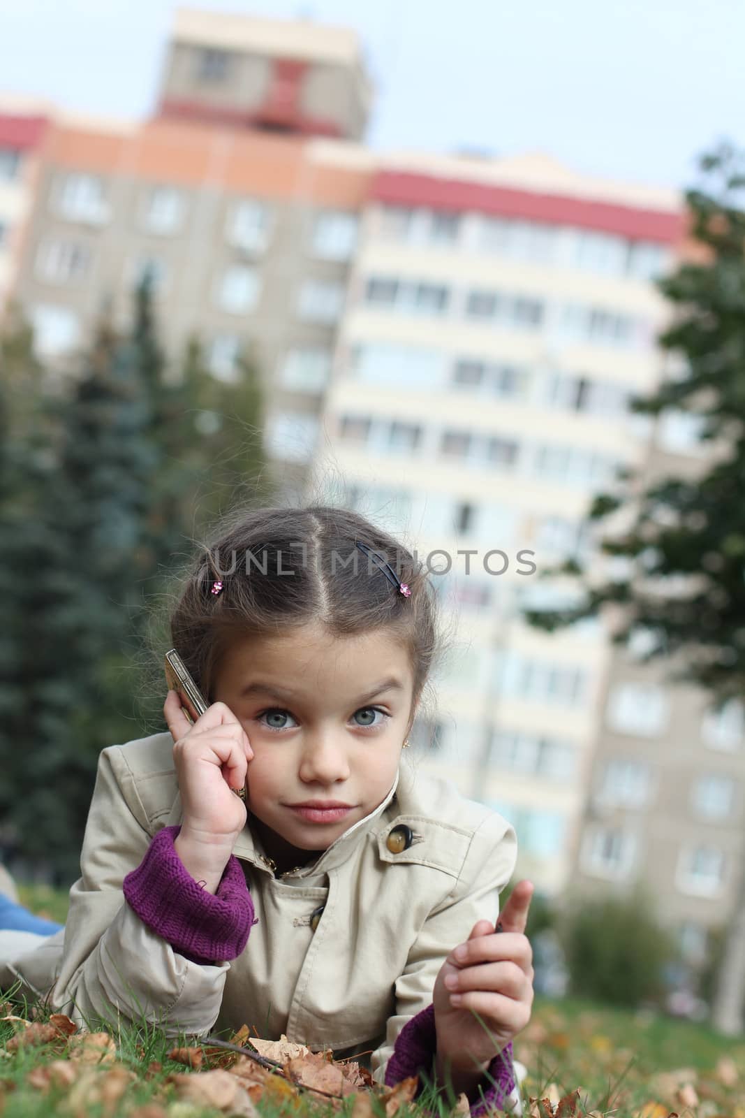 little girl talking on cell phone by andersonrise