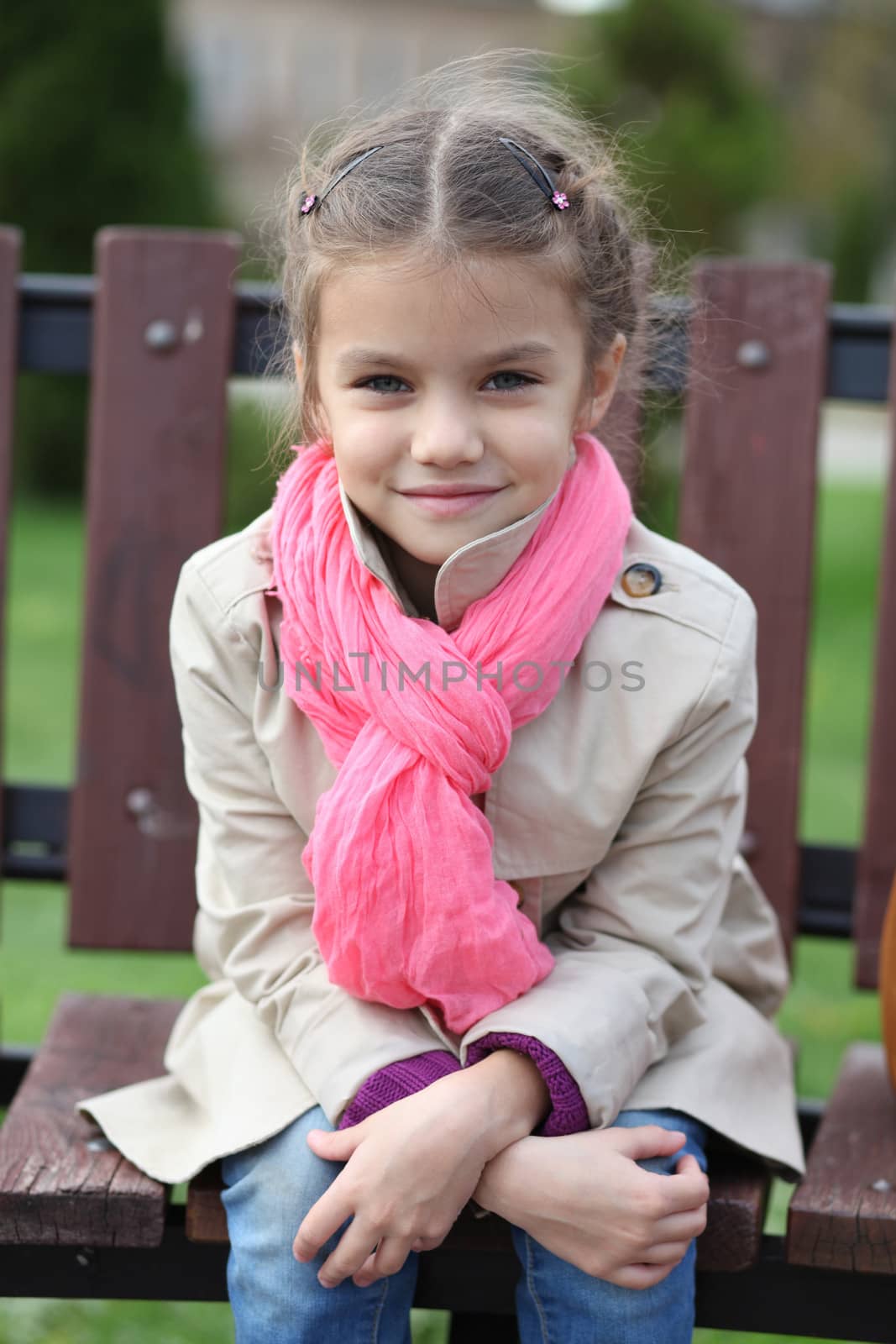 portrait of a beautiful girl in a pink scarf