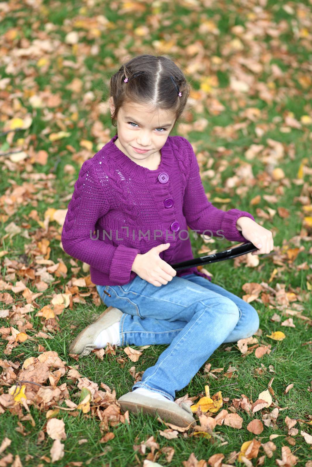Little Girl holding tablet digital computer by andersonrise