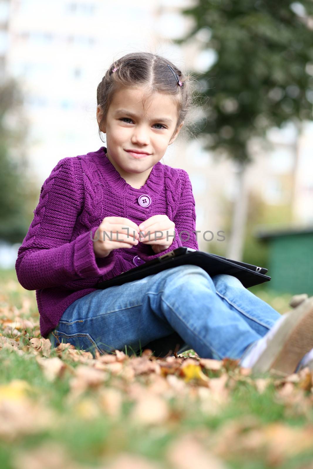 Little Girl holding tablet digital computer by andersonrise