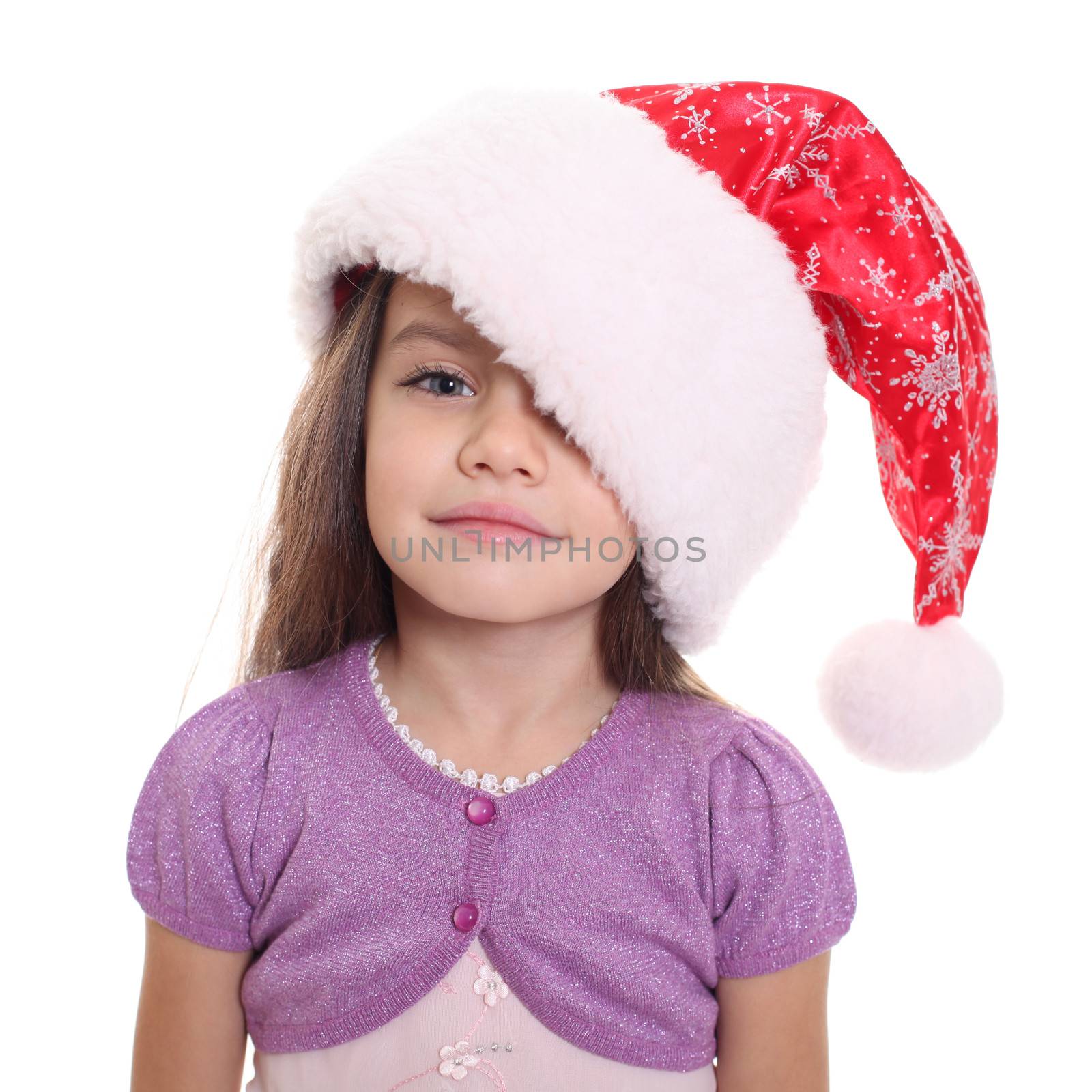 Portrait of happy little girl in Santa hat isolated on white background