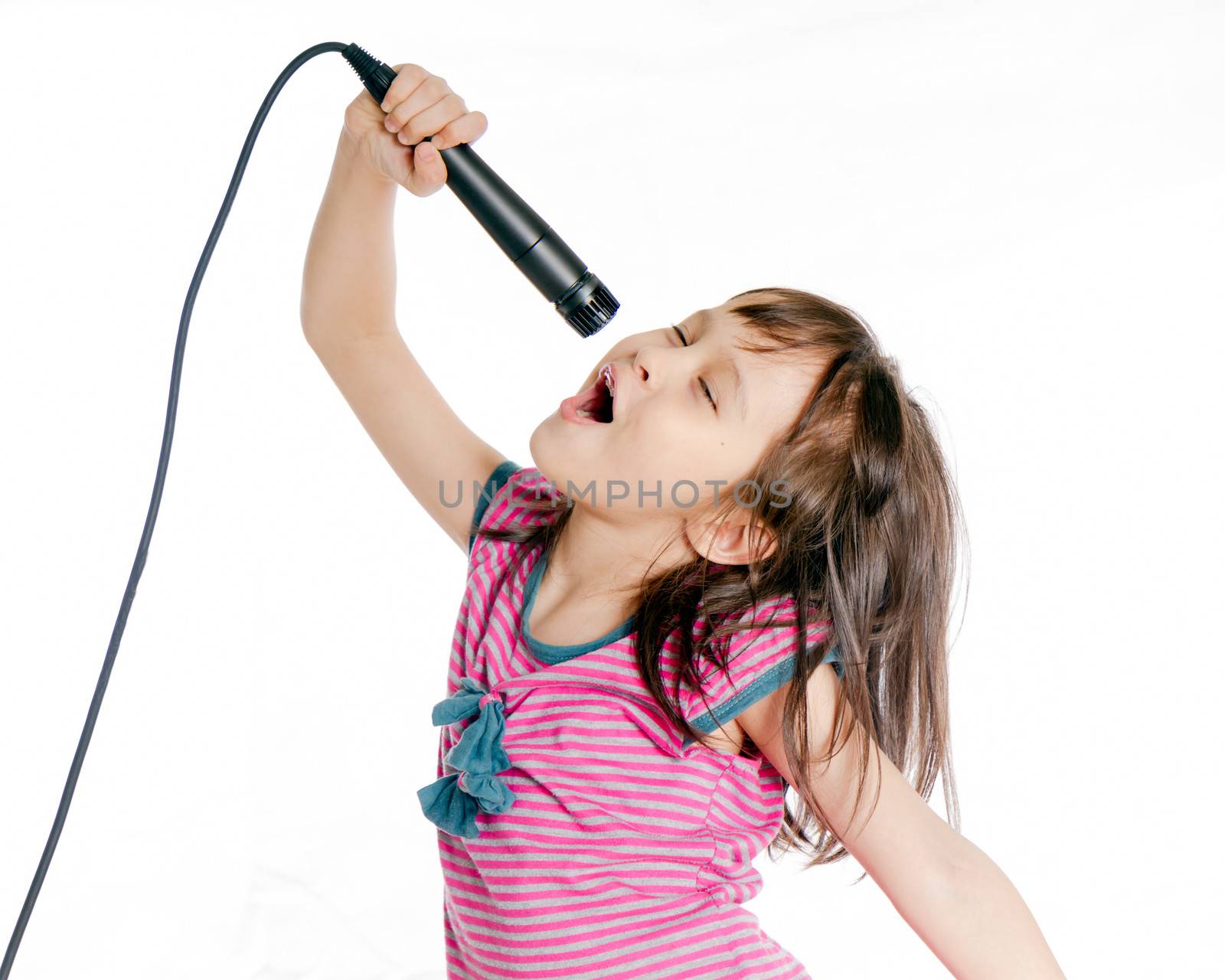 Asian female child singing with a microphone