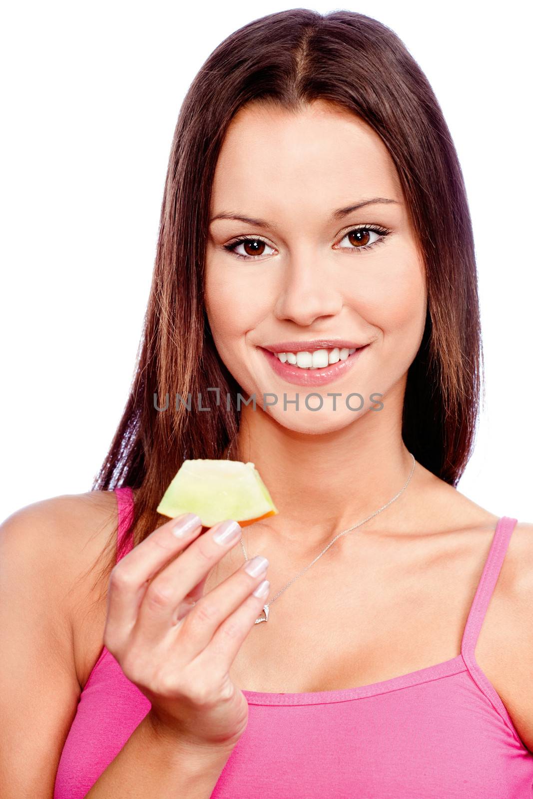 Young woman holding slice of yellow melon