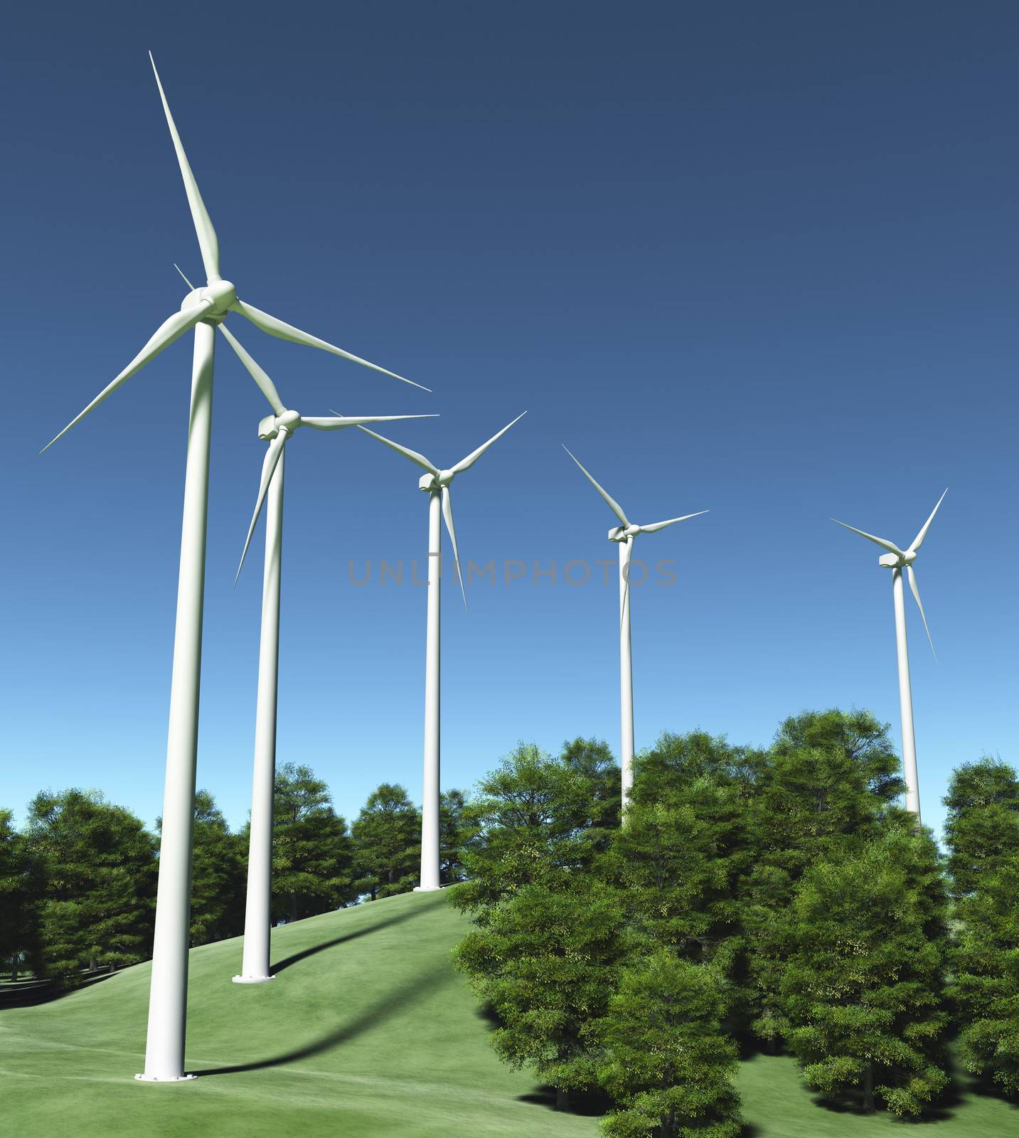 view of a grassy hill where are placed a row of white wind generators in the middle of some trees, and a clear blue sky on the background