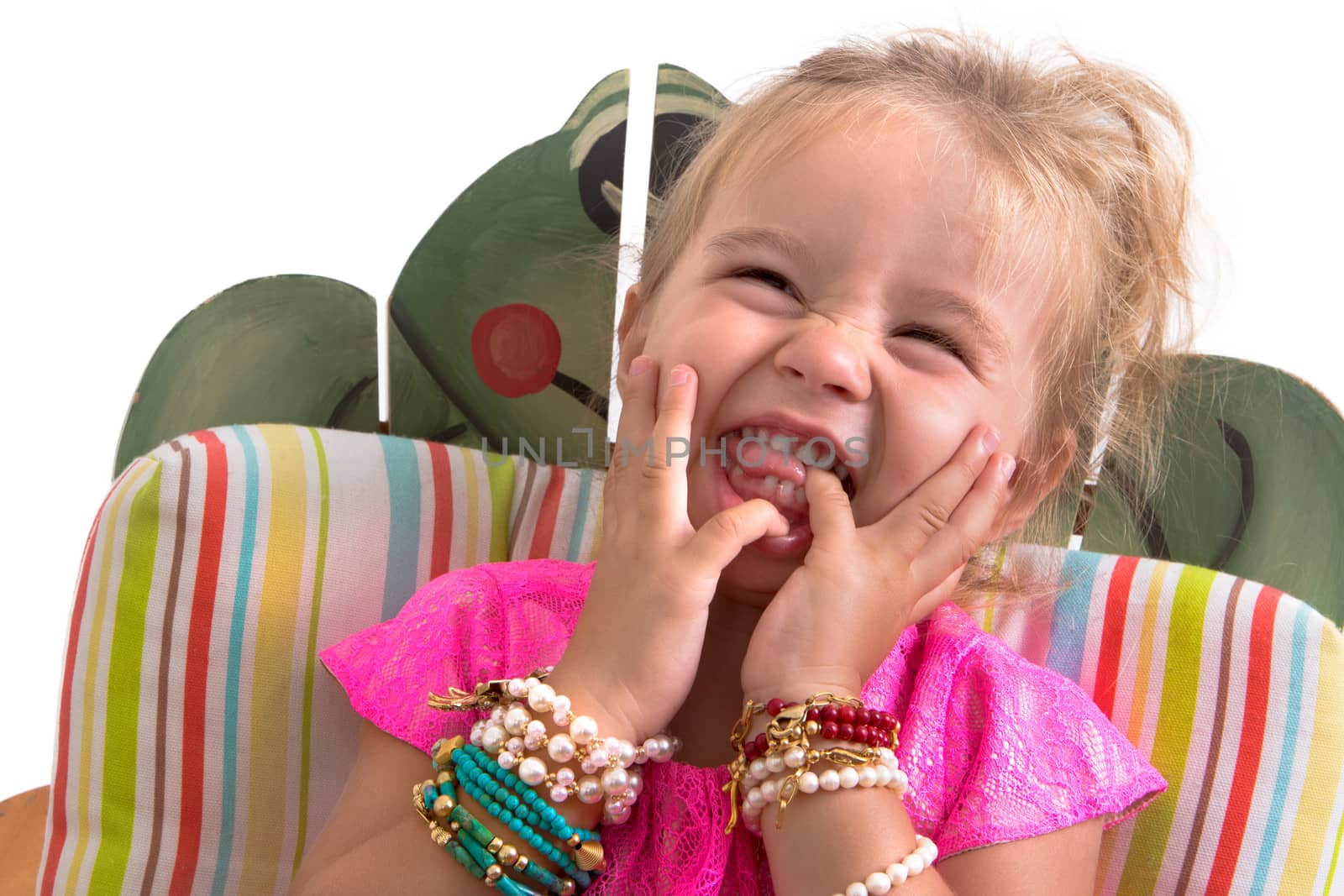 child sitting and laughing isolated on white