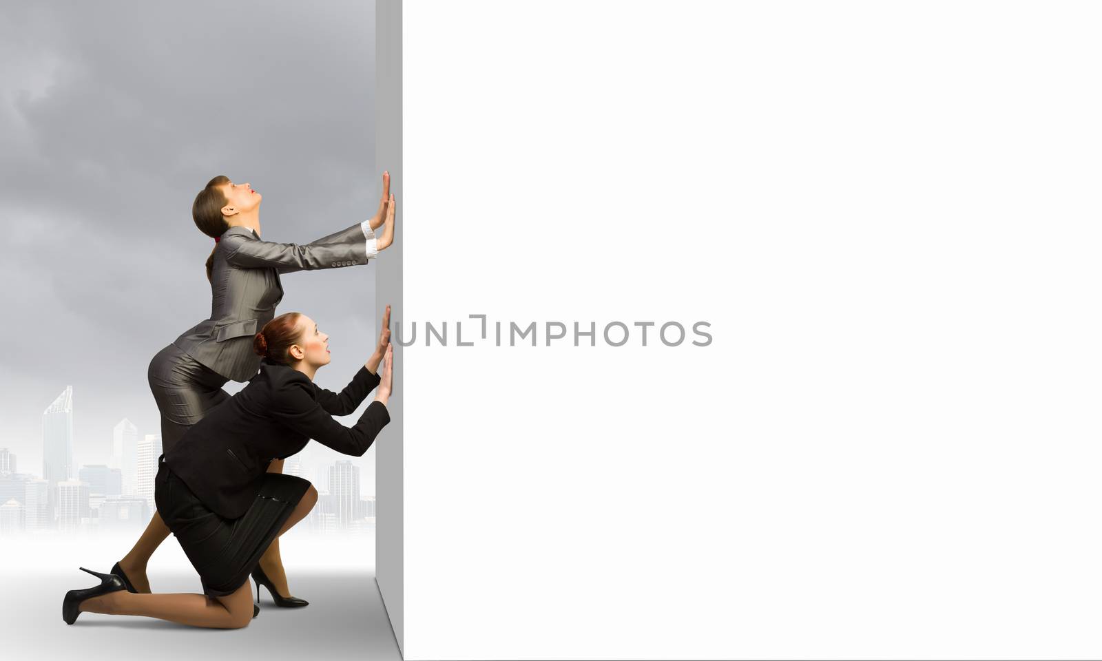 Two businesswoman pushing blank white banner. Place for text