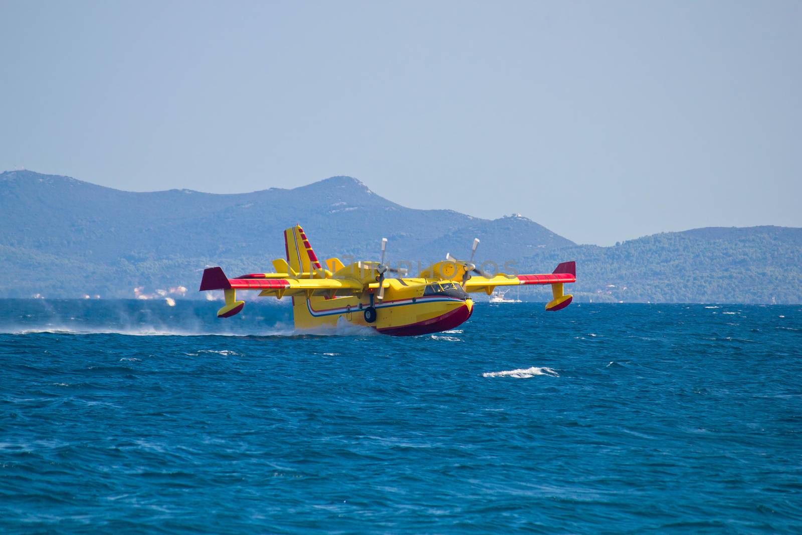 Firefighting airplane taking water from sea by xbrchx