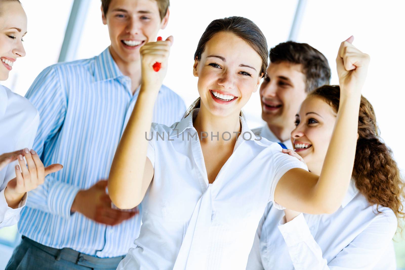 Image of young businesspeople congratulating colleague. Success concept