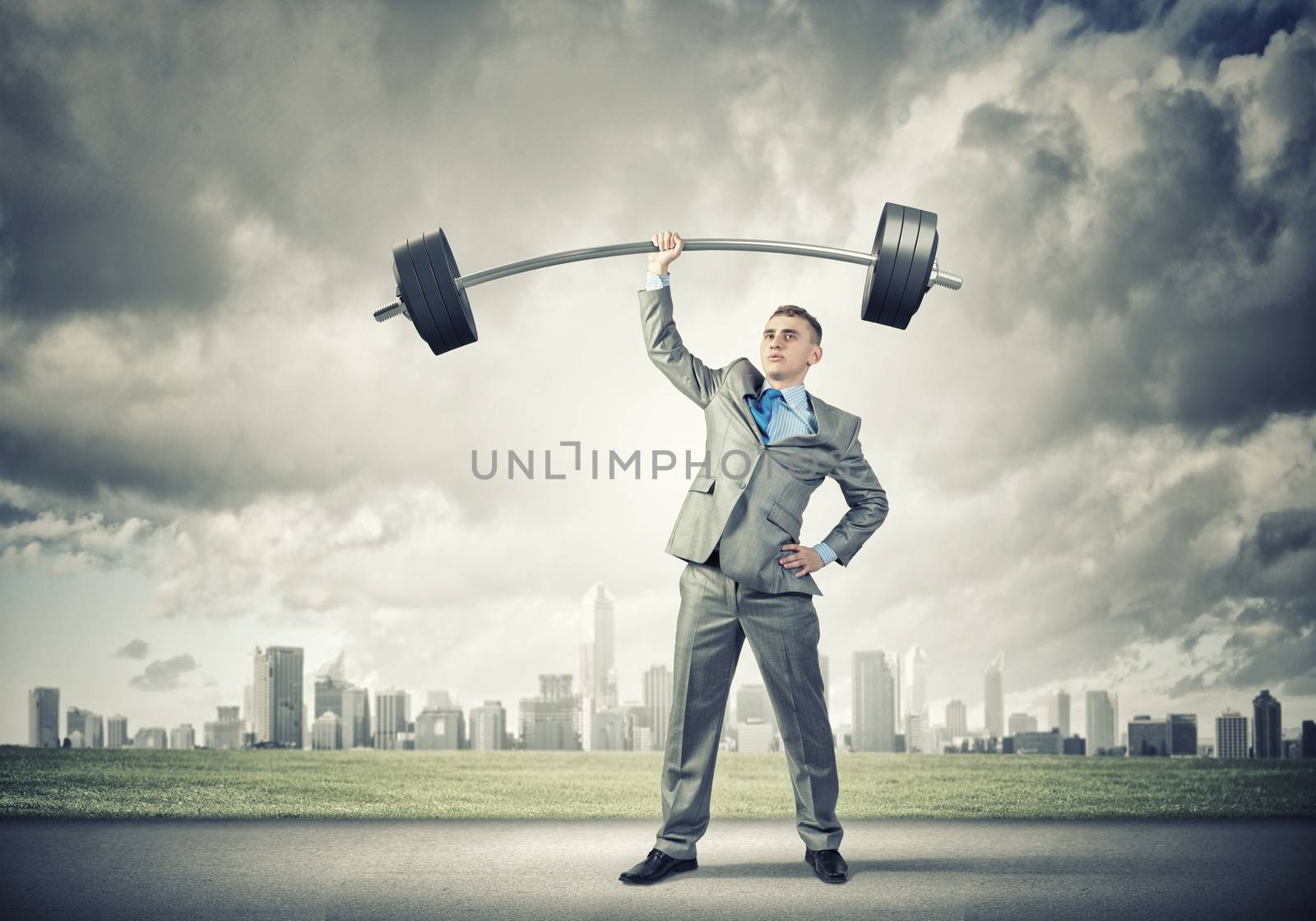 Image of strong businessman lifting barbell above head with one hand