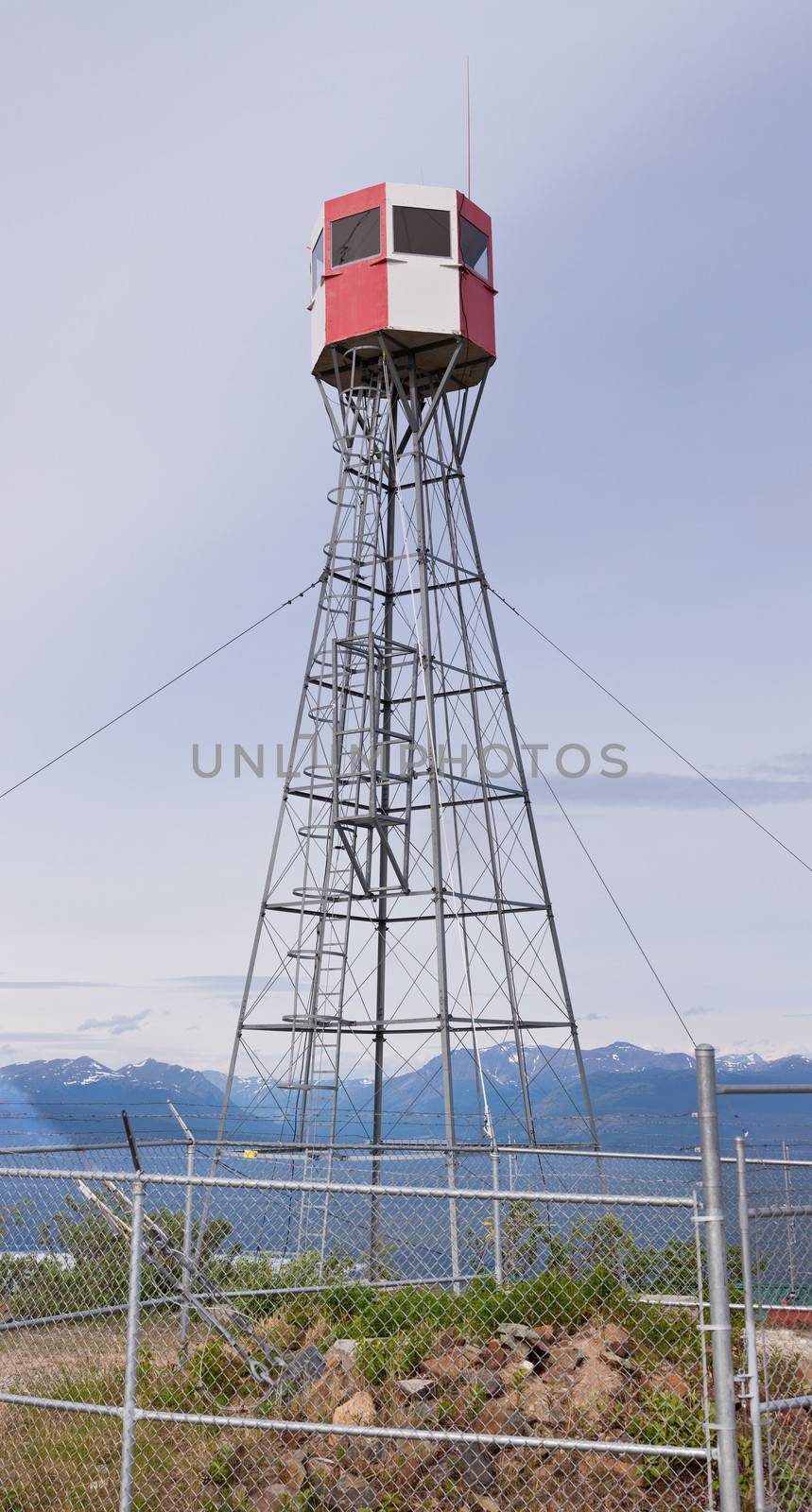 Forest fire watch tower tall architectural steel lookout structure overlooking mountain area of Tagish  Yukon Territory  Canada