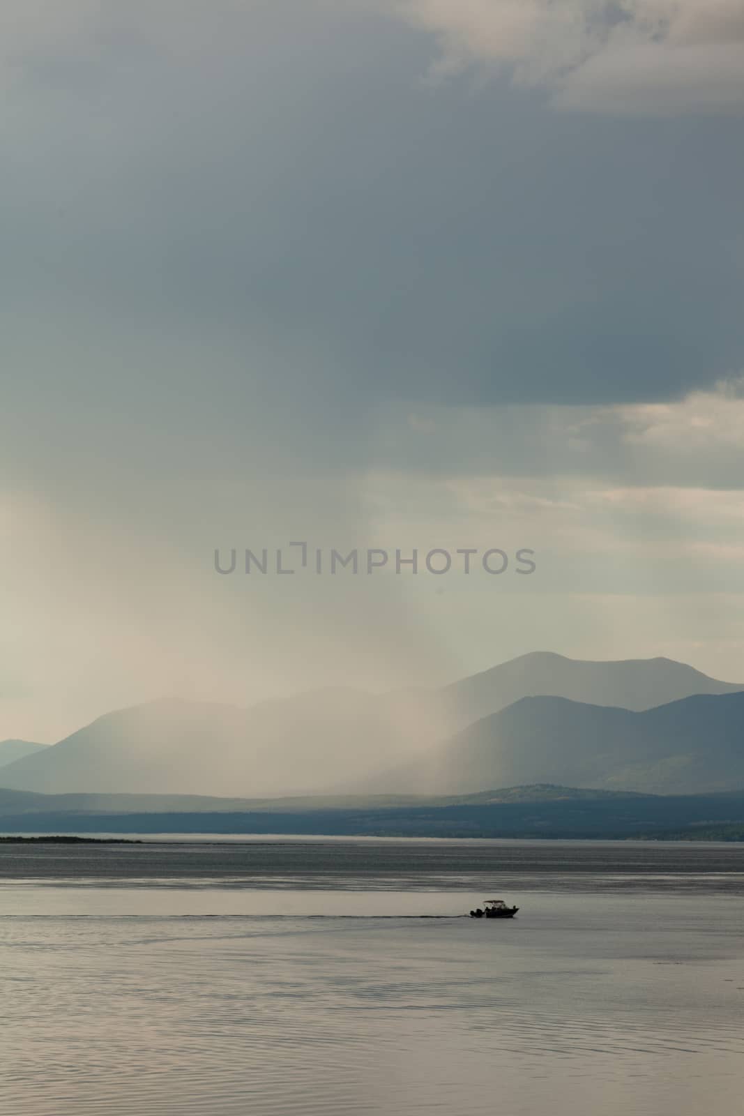 Rain shower over Marsh Lake Yukon Territory Canda by PiLens