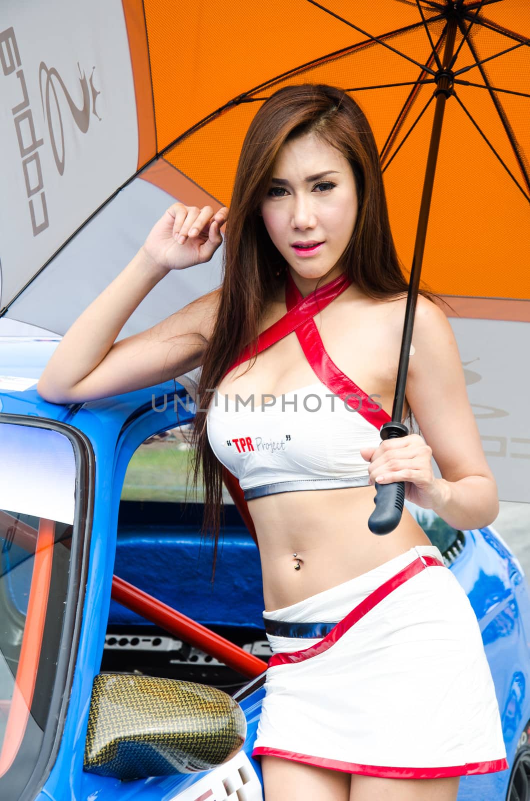 CHOUN BURI - AUGUST 18: Unidentified model with racing car on display at the Thailand Super Series 2013 Race 4 on August 18, 2013 at the Bira International Circuit Pattaya, Thailand.