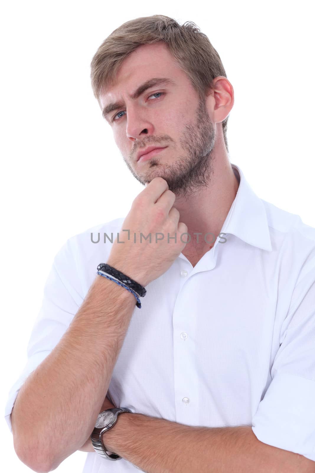 Portrait of a young man standing against white background