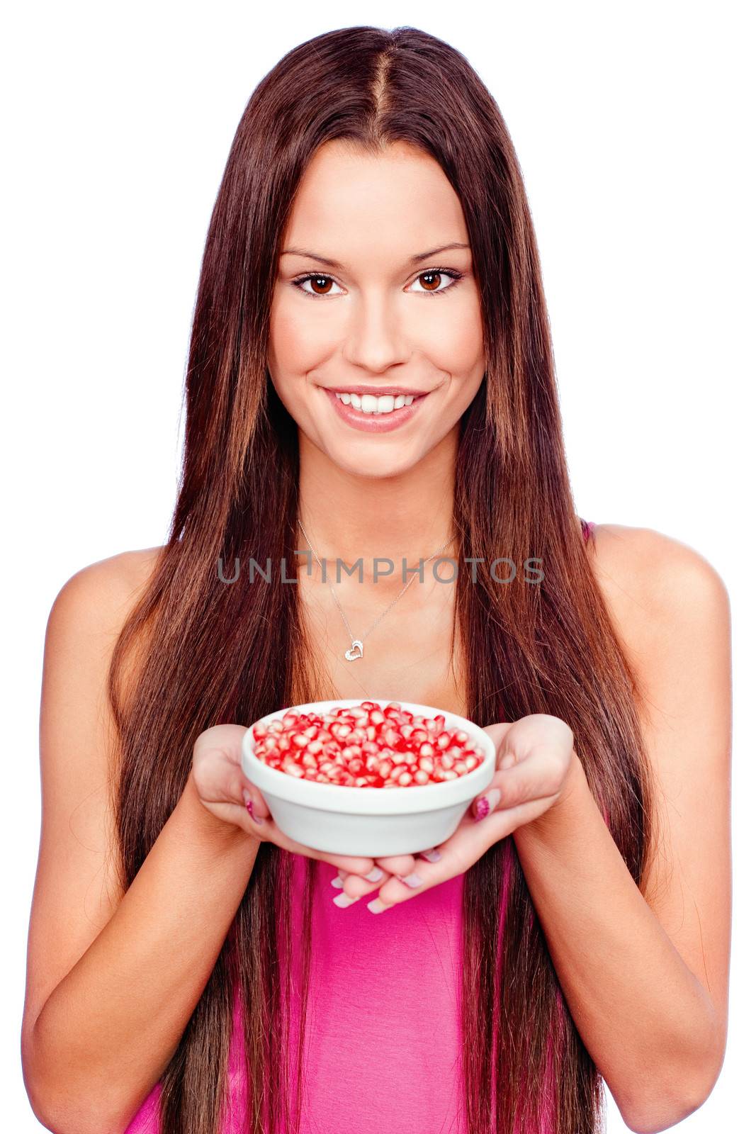 Young woman holding pomegranate on plate