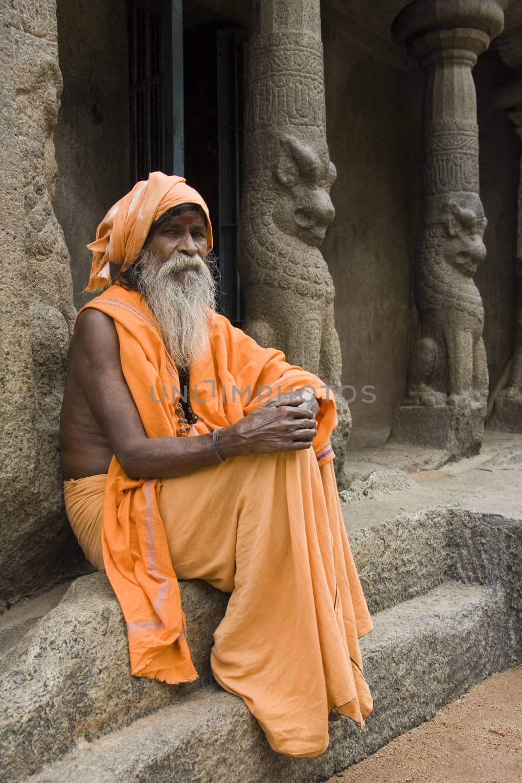 Hindu Holy Man at a monalthic Hindu Temple in Mahabalipuram in the Tamil Nadu region of southern  India