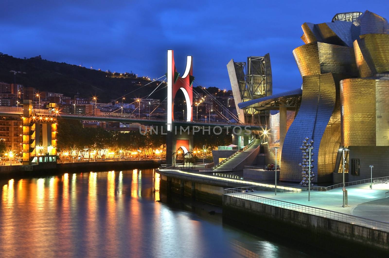 The seaport of Bilbao in the province of Biscay in northern Spain. View of the Nervion River, the Puente de la Salve (Bridge) and the Guggenheim Museum.